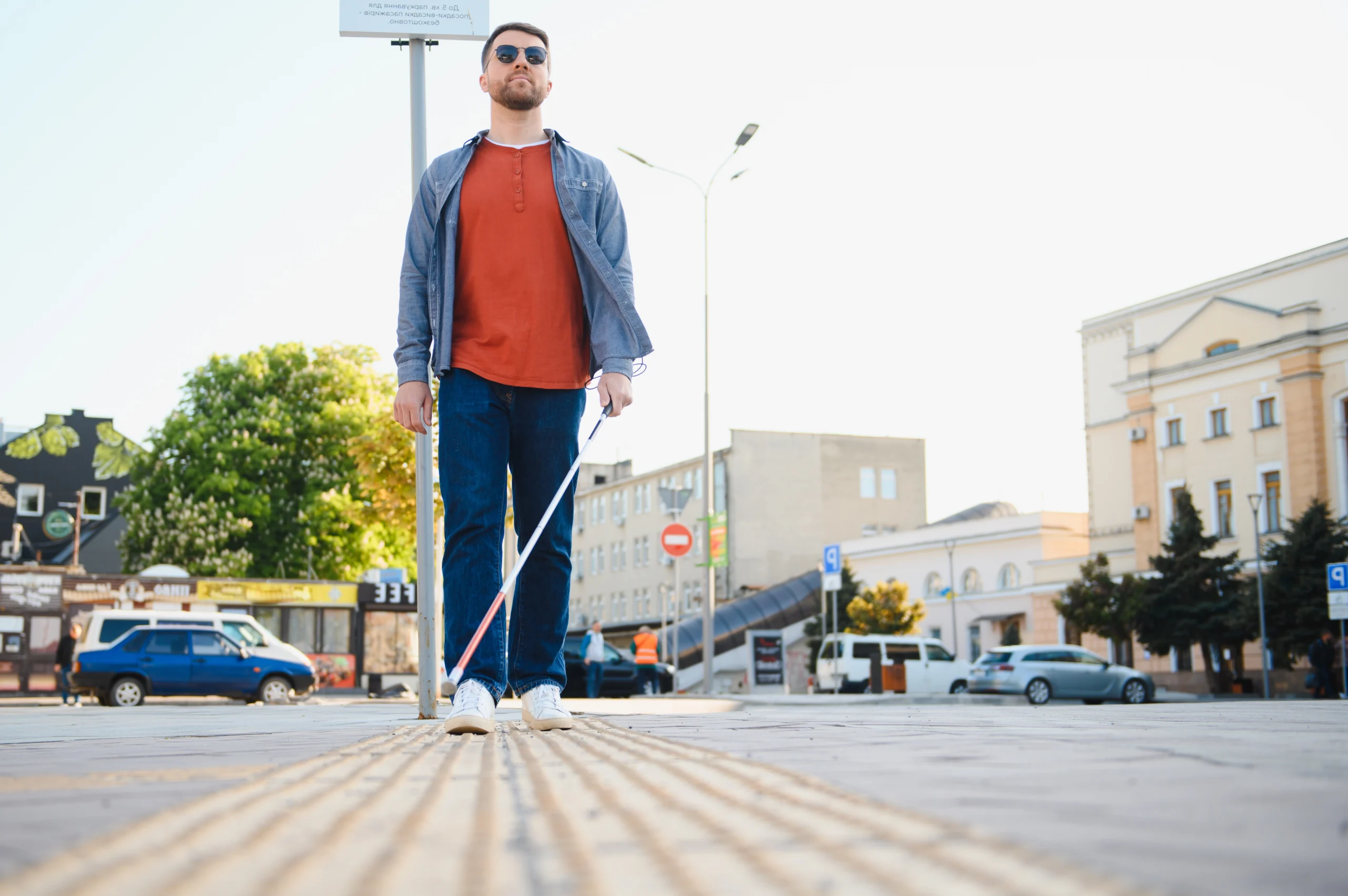 blind man walking across the street