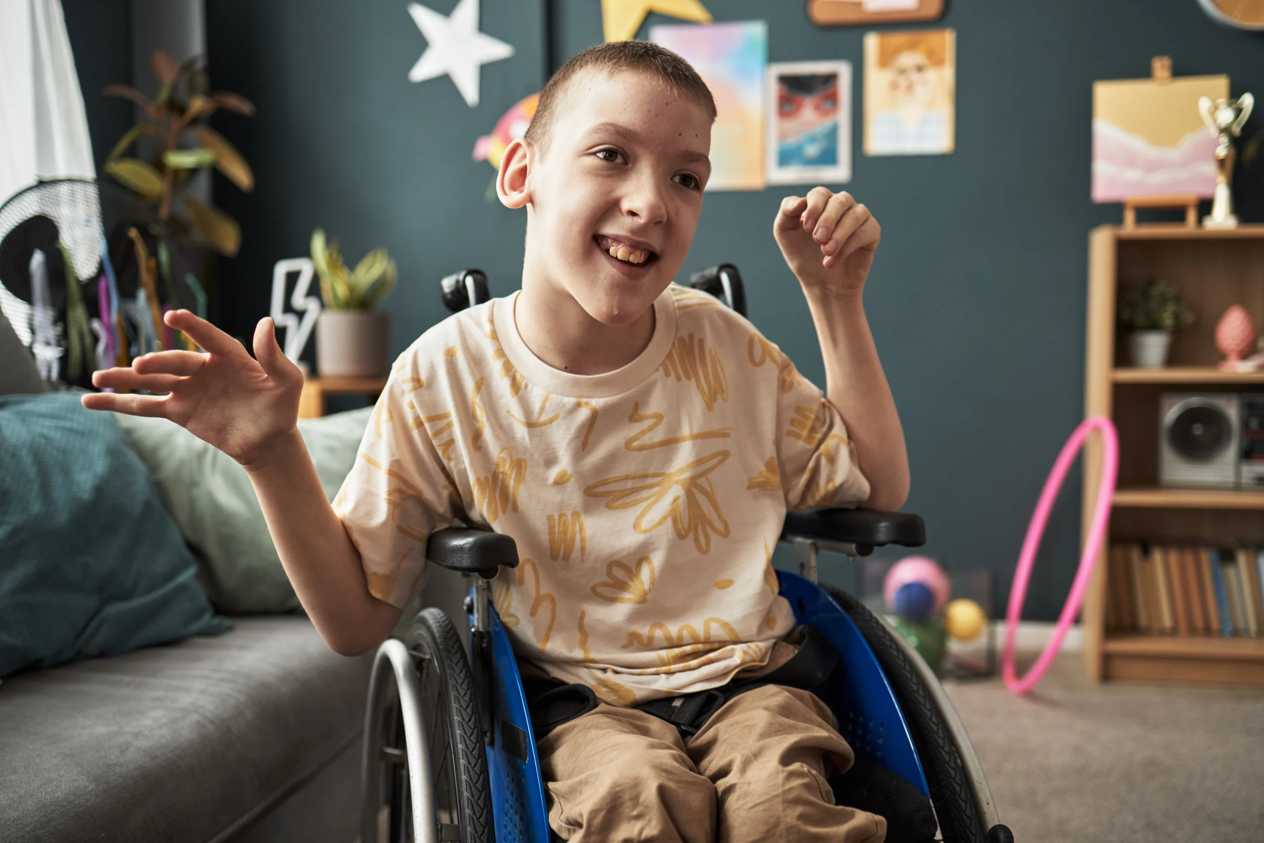 smiling teenager in a wheelchair at home