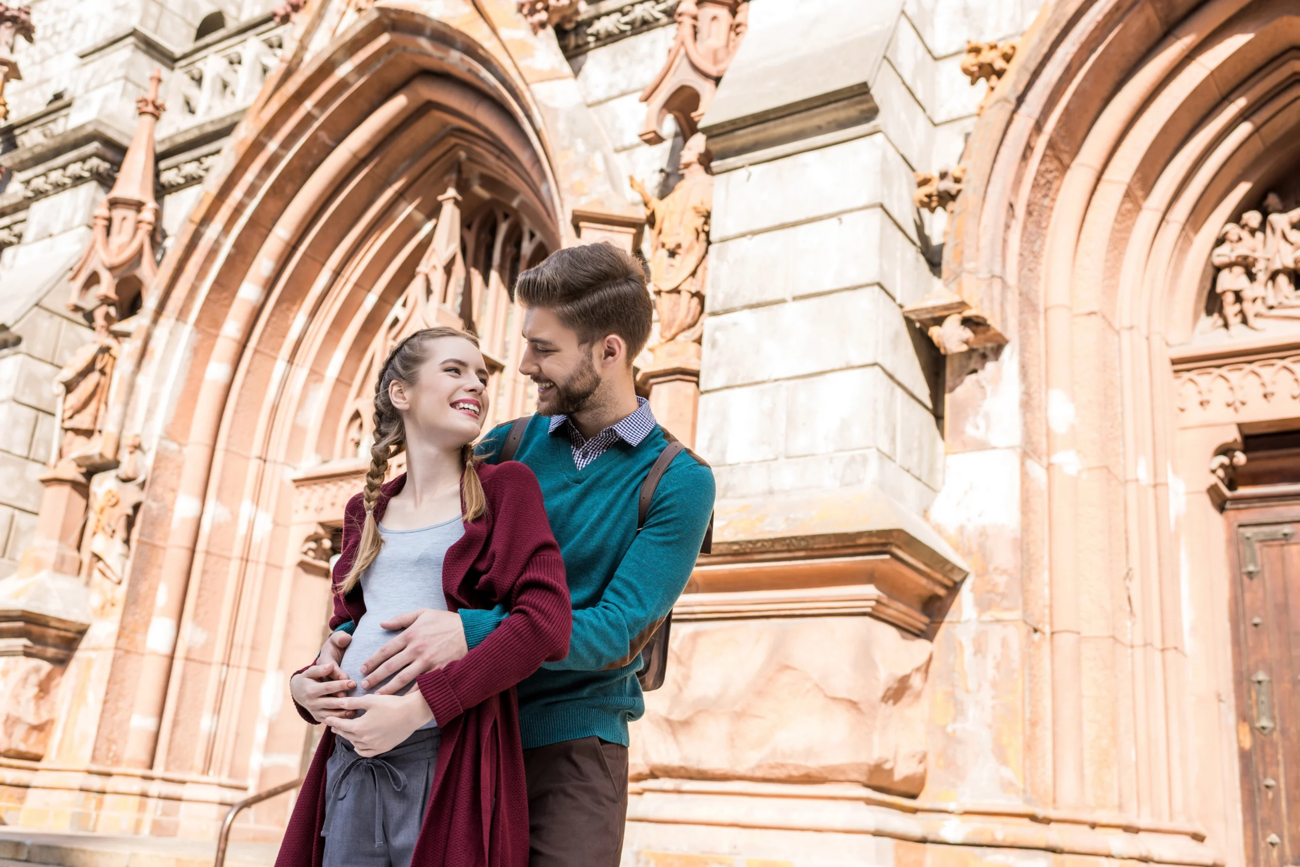 young couple outside of a church