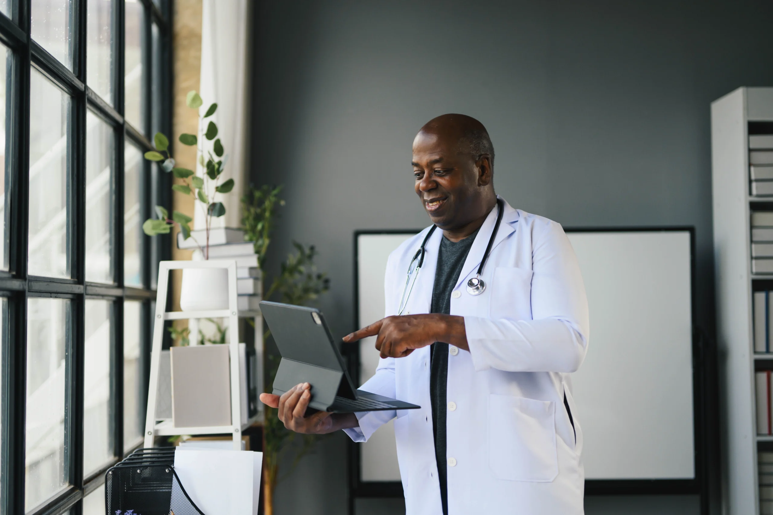 African American us0ing a tablet in his office