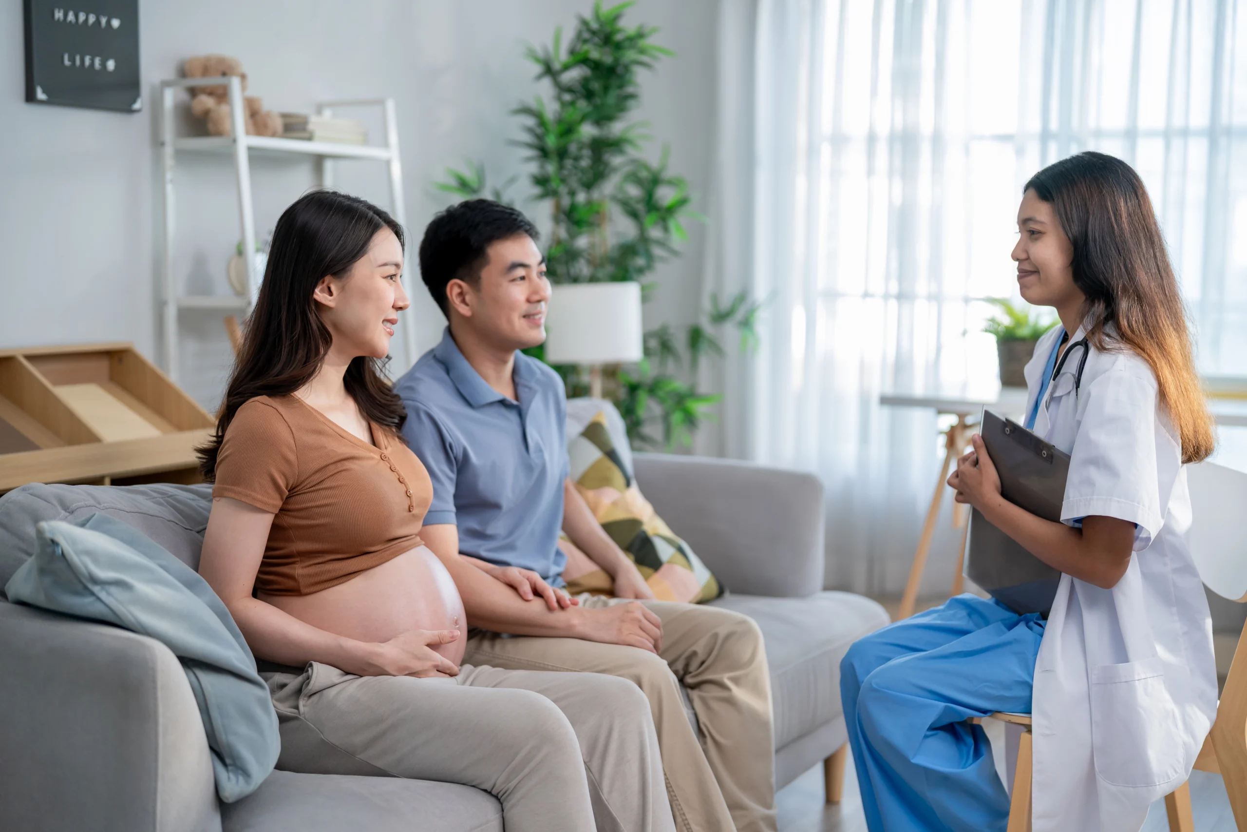 pregnant couple talking with healthcare provider