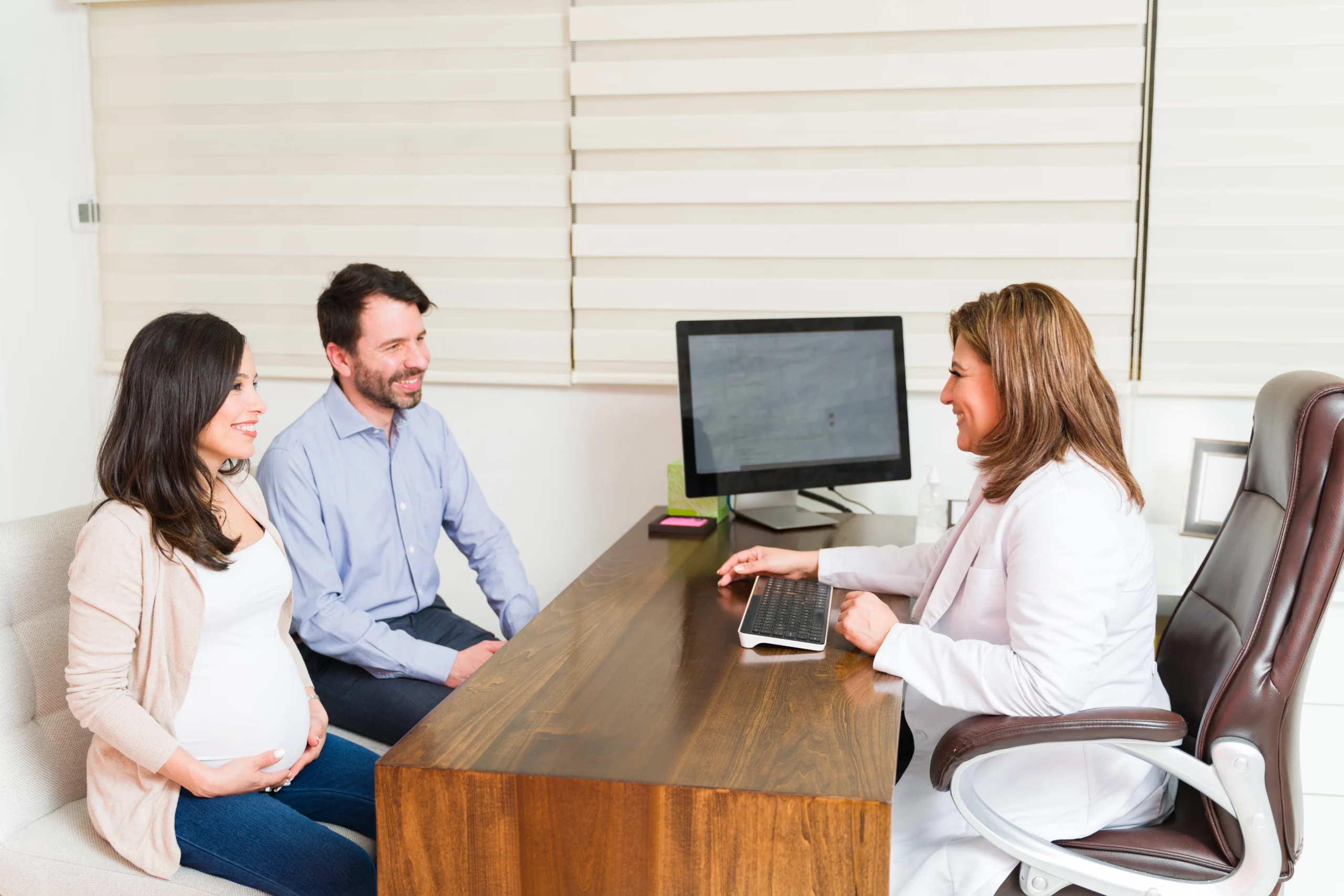 expecting couple consulting with doctor