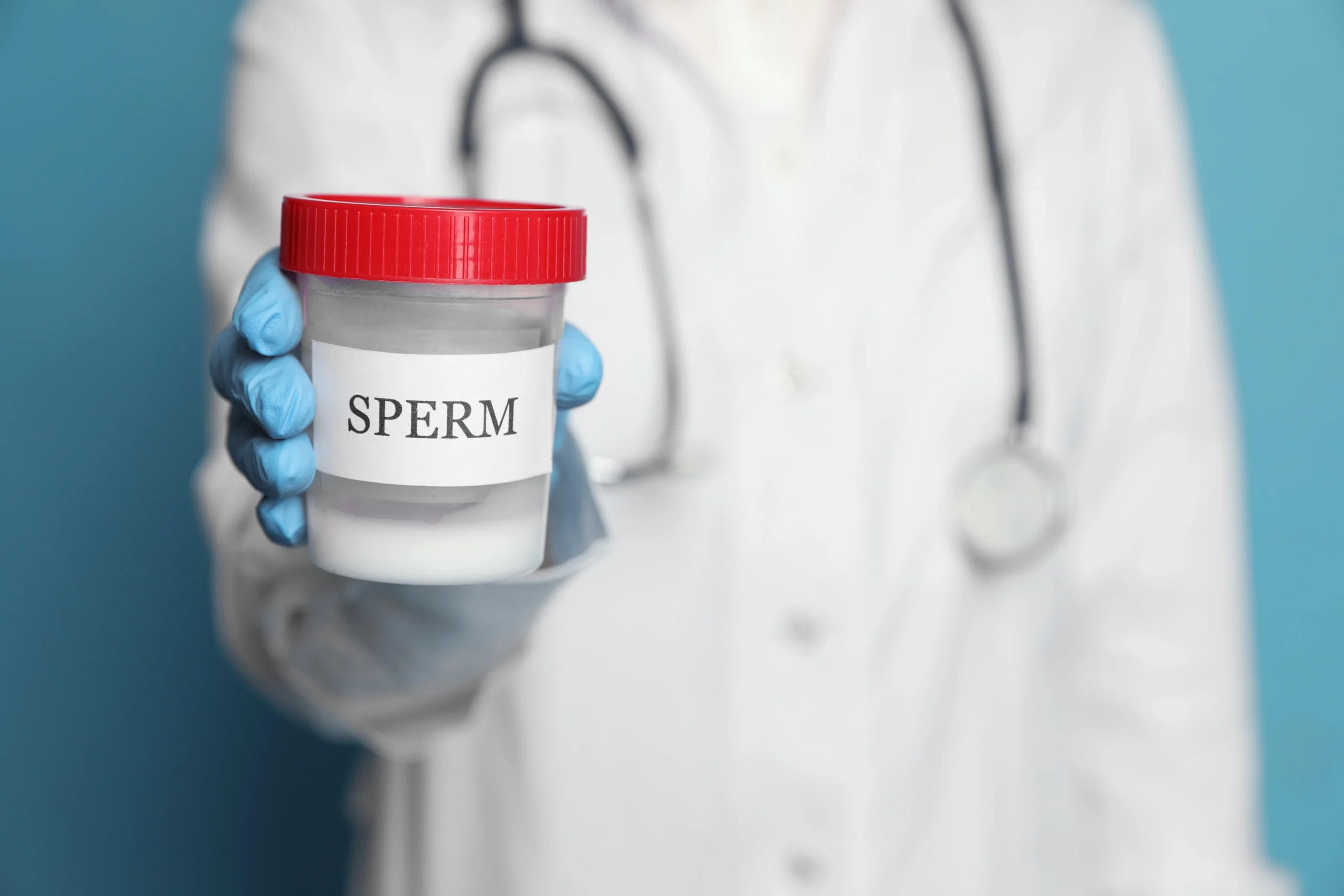 doctor holding sperm sample