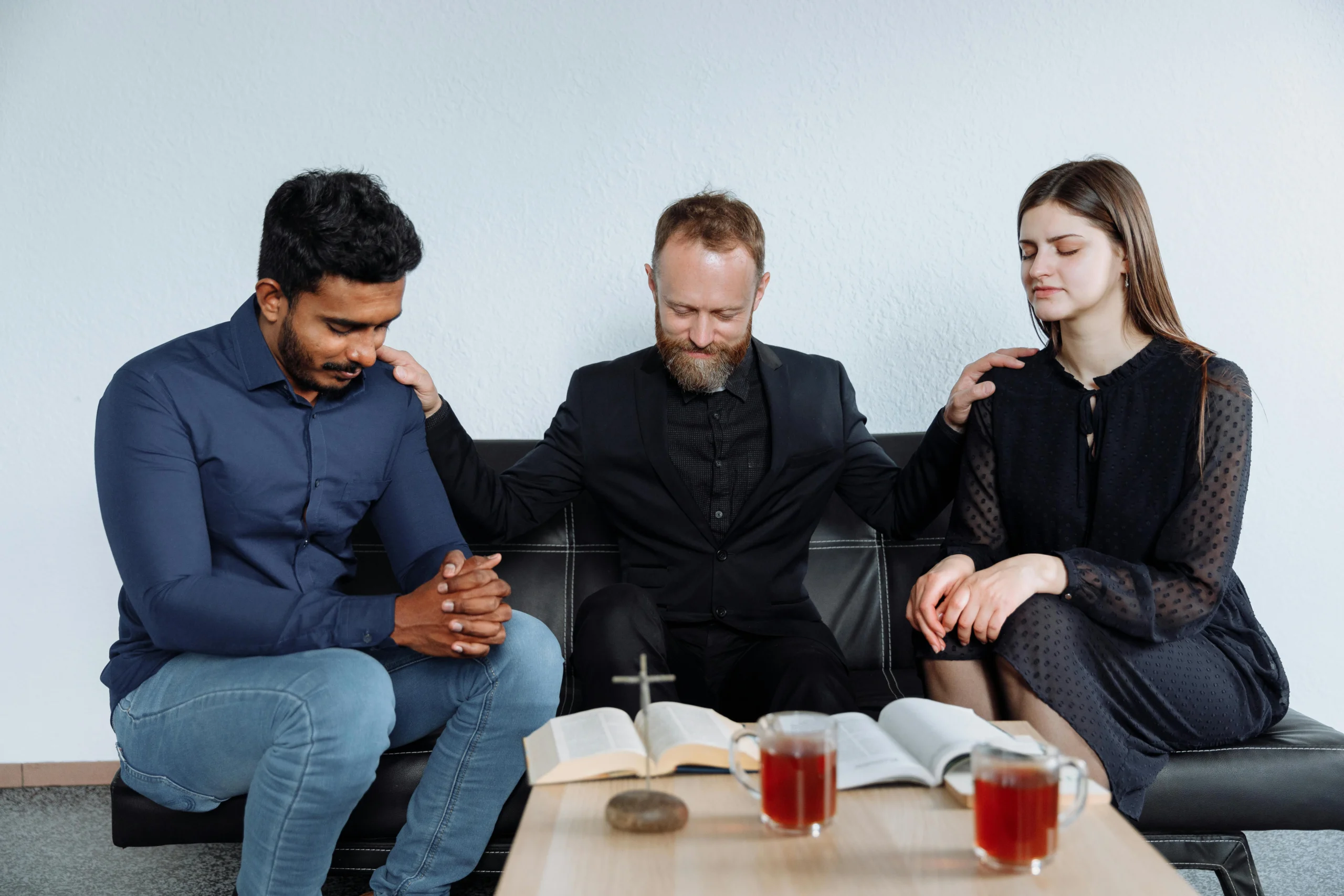 couple chatting with a pastor