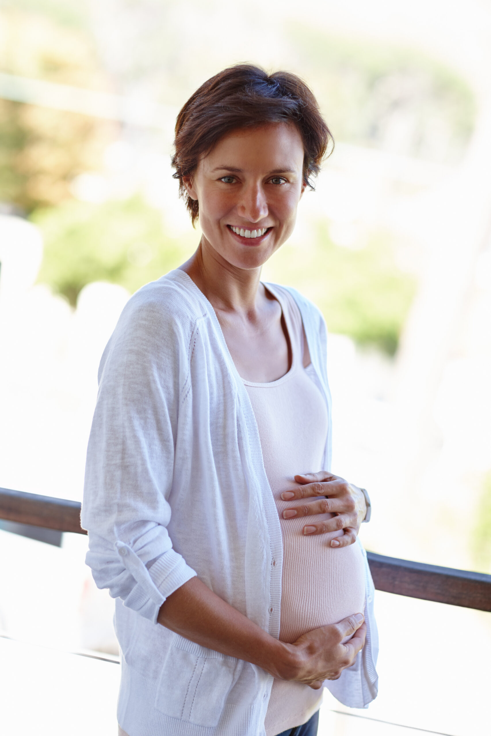 pregnant woman holding her belly