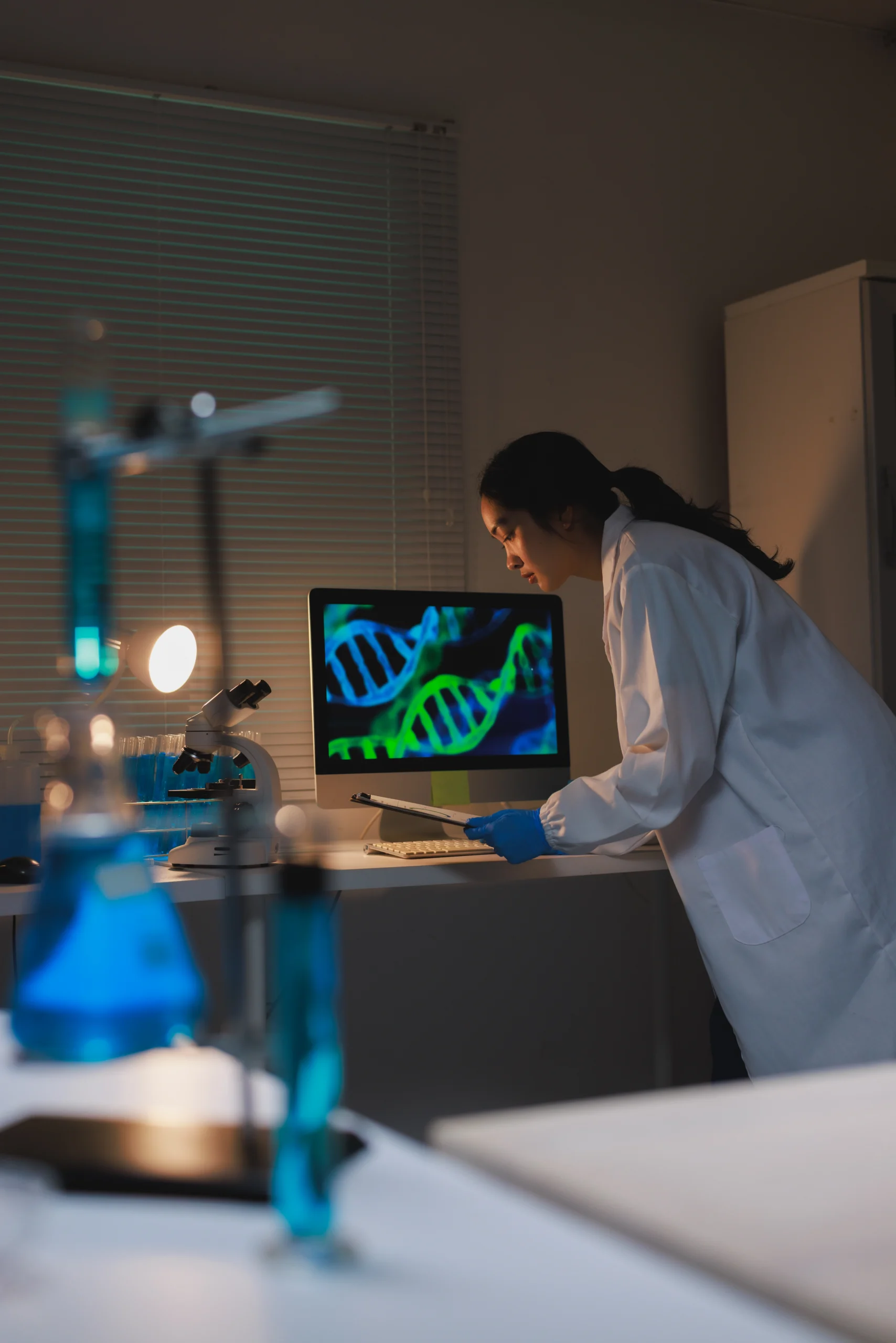 doctors in a lab at night working with DNA